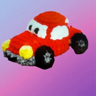 Crocheted toy car with attached wheels for pretend play