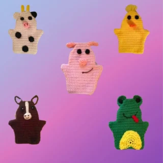 Set of five crocheted farm animal hand puppets including cow, pig, chicken, horse and frog