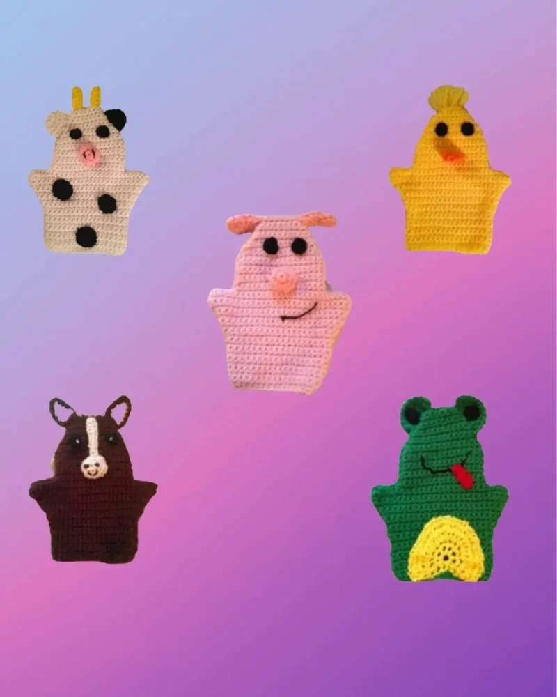 Set of five crocheted farm animal hand puppets including cow, pig, chicken, horse and frog