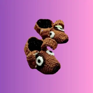 Handmade crochet dog slippers for children with floppy ears and crocheted face