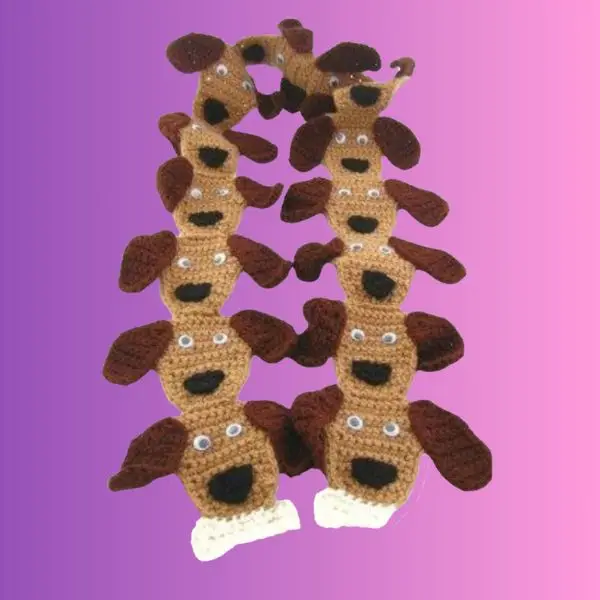Handmade crochet puppy dog scarf for children with puppy details and bones at each end