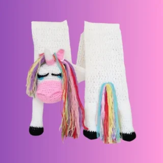 Handmade white crochet unicorn scarf with colorful yarn mane and tail
