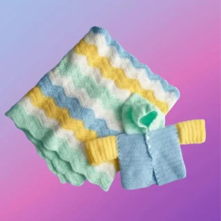 Handmade crochet baby set with coordinating blanket, sweater and hat