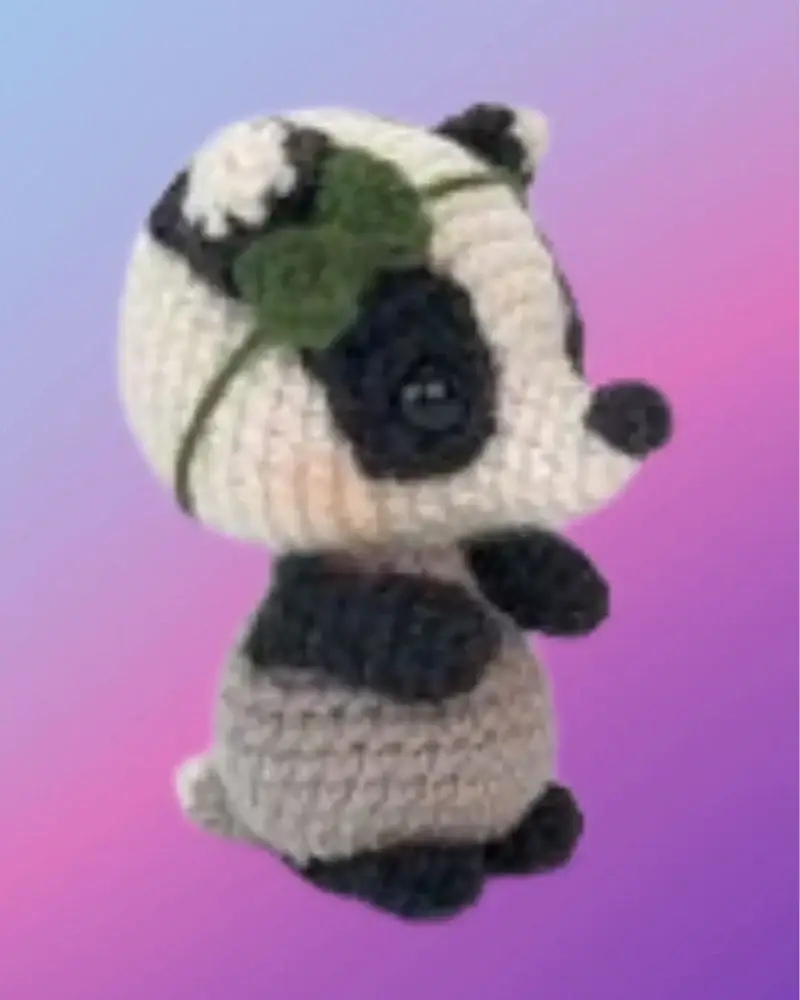 Crocheted Blossom the Badger woodland critter with flower on her head