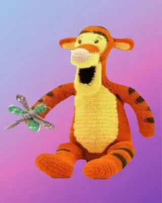 Handmade crochet Bouncy Tiger Amigurumi with removable dragonfly.