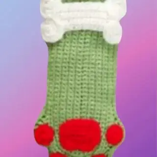 Crocheted pet stocking with paw print and bone or fish bone design