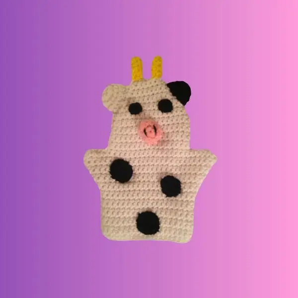 Cow Puppet Crocheted cow hand puppet with black spots, pink snout and yellow horns