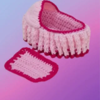 Crocheted cradle purse with matching blanket and drawstring-style closure