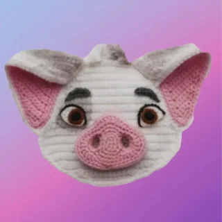 Handmade crochet pig appliqué for blankets, clothing, accessories, and custom crochet projects.