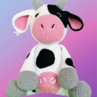 Handmade crochet Farm Cow Amigurumi with black and white markings by D's & B's Gifts.