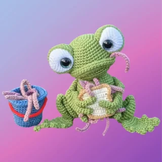 Handmade crochet Fishing Frog Amigurumi with a bucket of worms and worm sandwich.