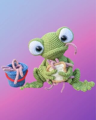 Handmade crochet Fishing Frog Amigurumi with a bucket of worms and worm sandwich.