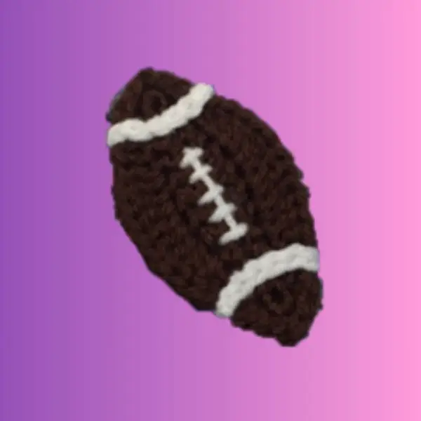 Handmade crochet football appliqué with stitched details