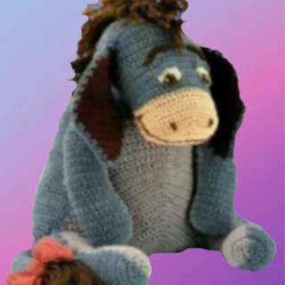 Handmade crochet Gentle Donkey with bow on tail.