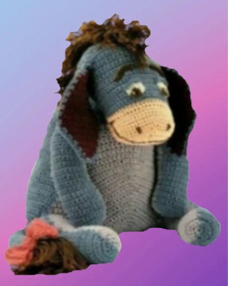 Handmade crochet Gentle Donkey with bow on tail.
