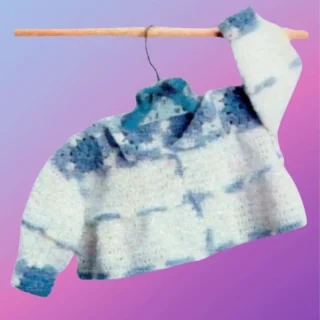 Handmade crochet baby sweater with granny square top and long sleeves