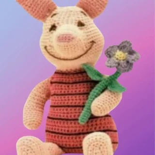Handmade crochet Happy Little Pig with flower.