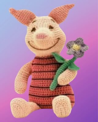 Handmade crochet Happy Little Pig with flower.
