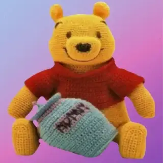 Handmade crochet Honey Pot Bear with removable shirt and honey pot.