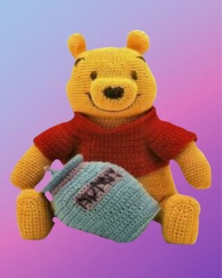 Handmade crochet Honey Pot Bear with removable shirt and honey pot.