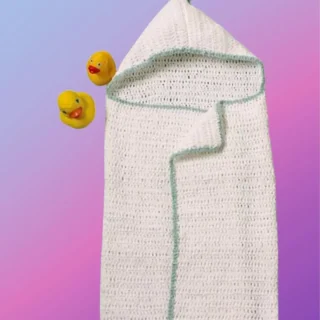 Handmade crochet baby hooded bath wrap with contrasting trim and pompom