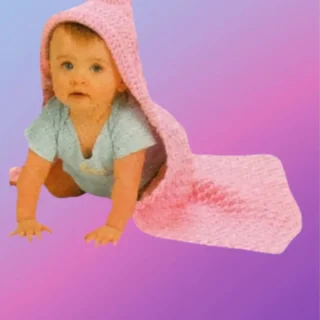 Handmade crochet hooded baby blanket shown with baby model