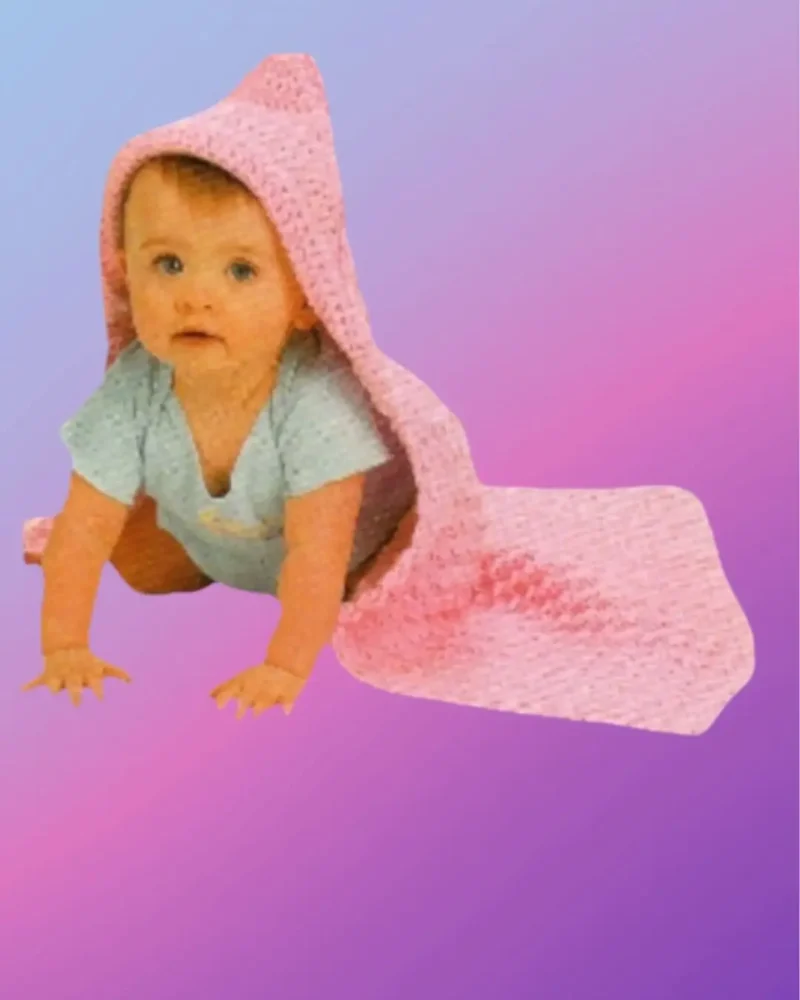 Handmade crochet hooded baby blanket shown with baby model
