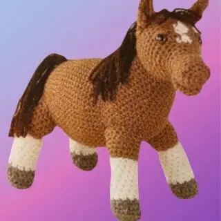 Handmade crochet Horse Amigurumi with white blaze, mane and tail.