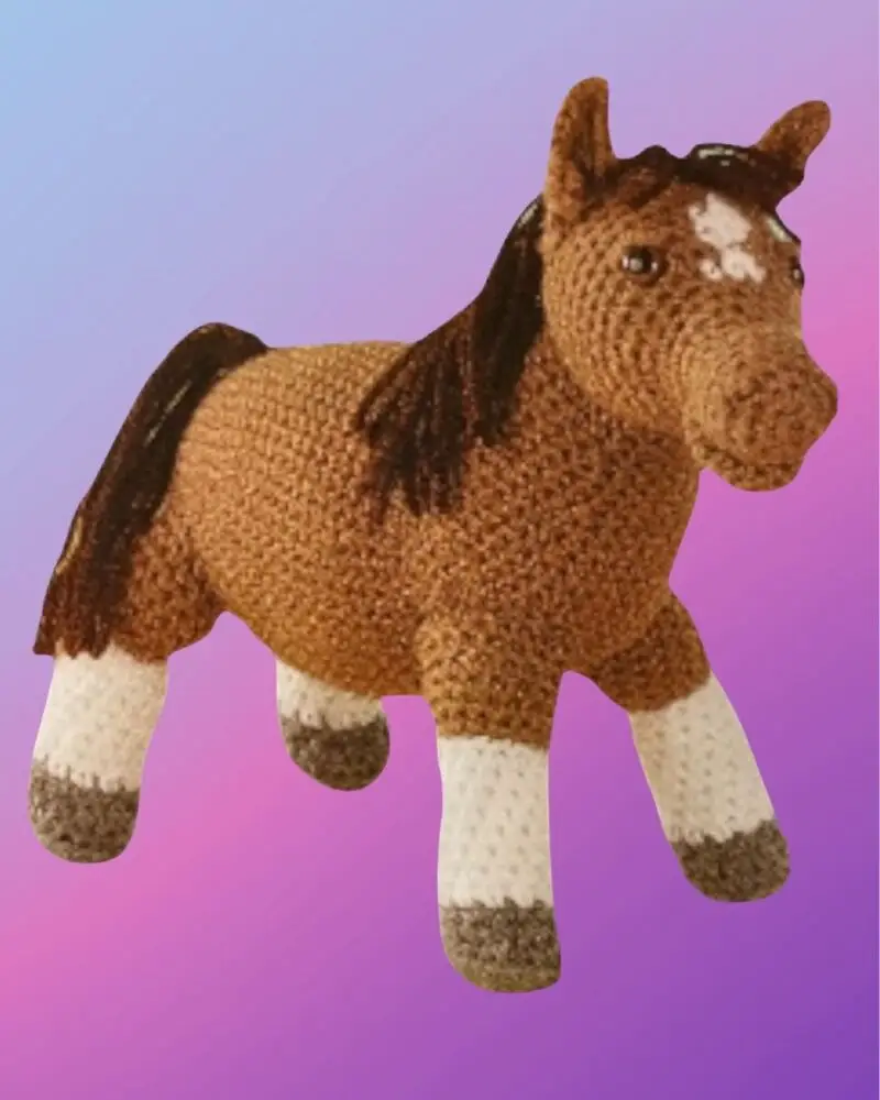 Handmade crochet Horse Amigurumi with white blaze, mane and tail.