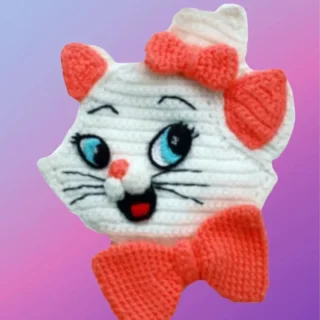 Handmade crochet kitty face appliqué with detailed facial features and bows