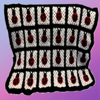 Handmade crochet baby blanket with individual ladybug designs sewn onto crocheted squares
