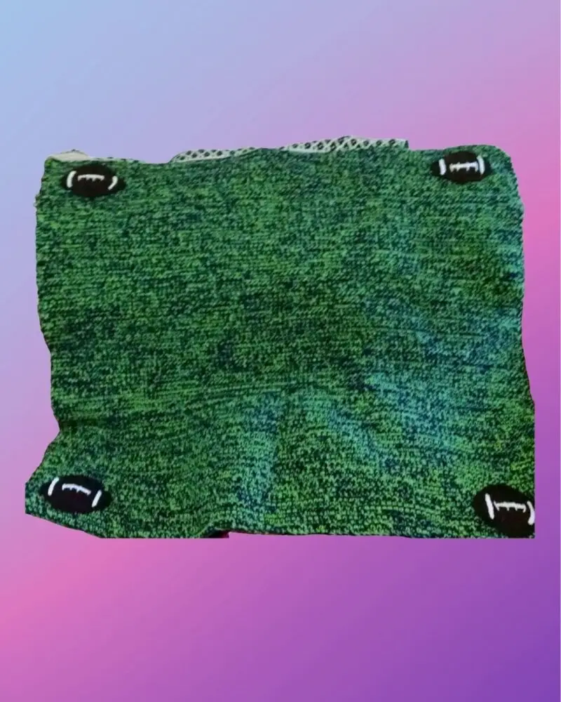 Crocheted lap blanket customized with football appliqués