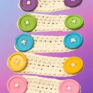 Mask Ear Saver Crocheted mask ear savers with colorful buttons that can also hold cords.