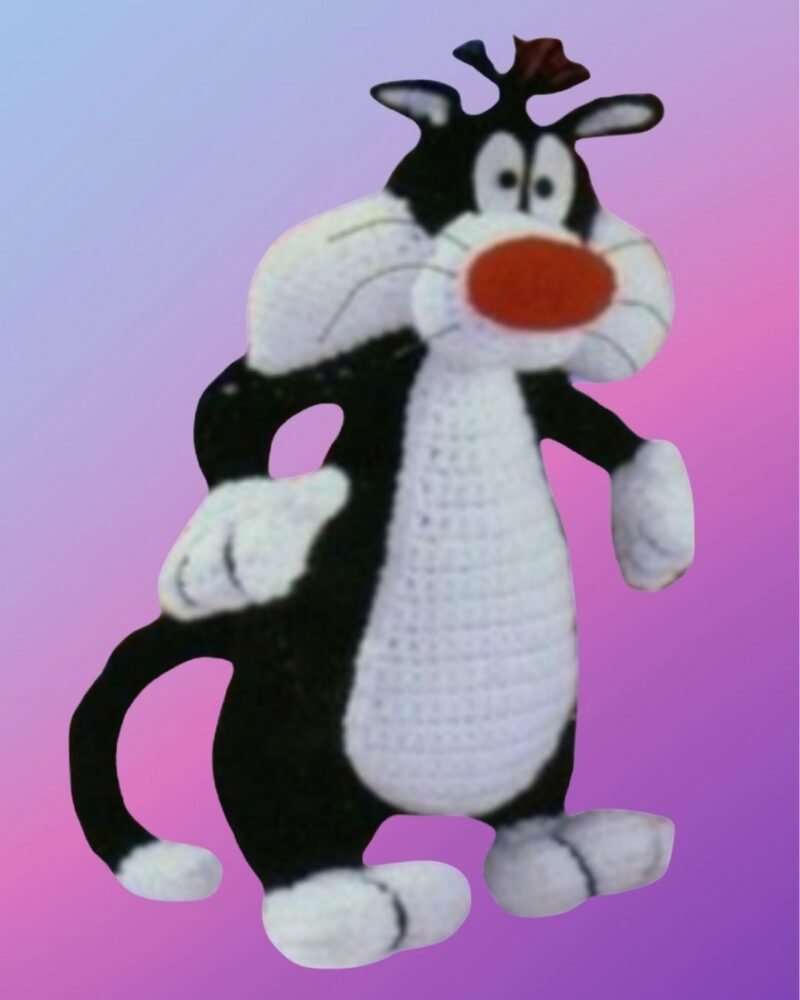 Handmade crochet Mischievous Tuxedo Cat with red nose and chubby cheeks.