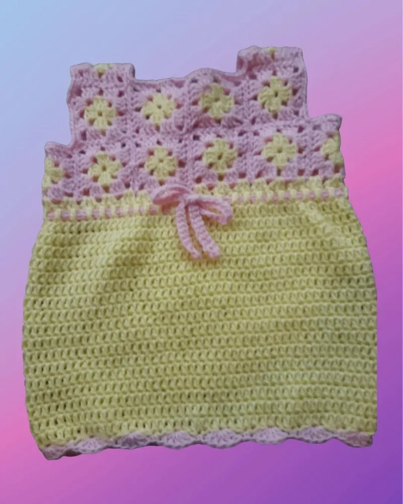 Handmade crochet newborn dress with granny square top and scalloped edging