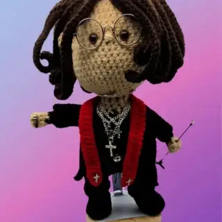 Rock star inspired crochet doll with glasses, necklaces, microphone and stand