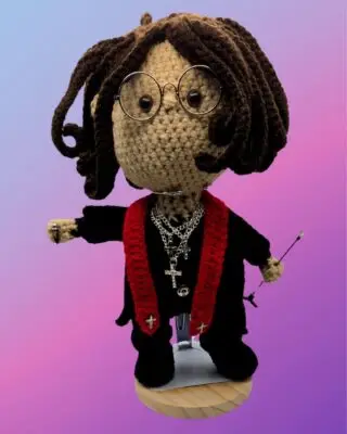 Rock star inspired crochet doll with glasses, necklaces, microphone and stand