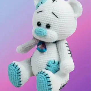 Handmade crochet Patchwork Teddy Bear with colorful crocheted patchwork squares.
