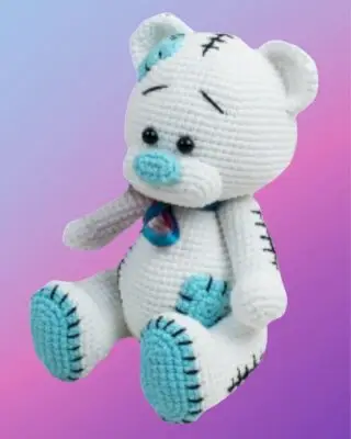 Handmade crochet Patchwork Teddy Bear with colorful crocheted patchwork squares.