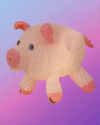 Handmade crochet Pig Amigurumi with curly tail.