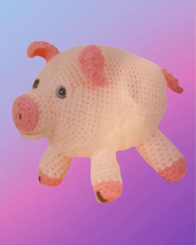 Handmade crochet Pig Amigurumi with curly tail.