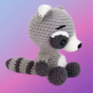 Crocheted Rex the Raccoon woodland critter with face mask and striped tail