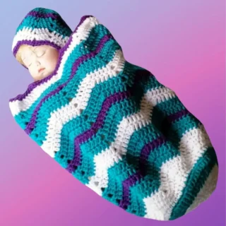 Handmade crochet ripple baby cocoon with matching hat