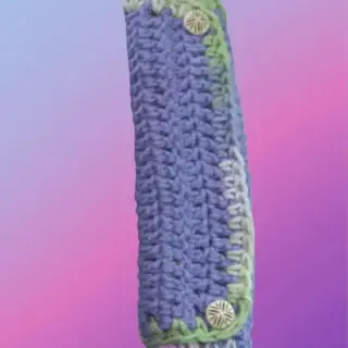 Crocheted seat belt cozy with button closures for neck and shoulder comfort