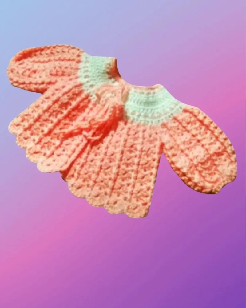 Handmade crochet baby sweater with shell stitch design and puff sleeves