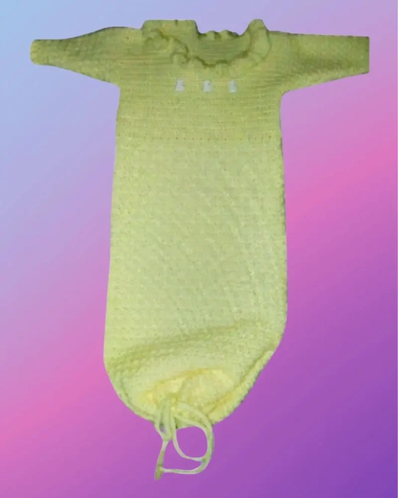 Handmade crochet baby sleeper sack with long sleeves, shell stitch collar, and drawstring bottom