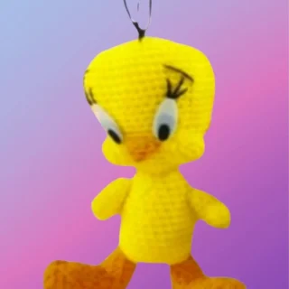 Handmade crochet Sunny Little Bird with oversized head and big feet.