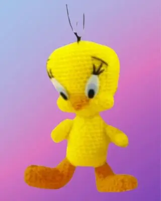 Handmade crochet Sunny Little Bird with oversized head and big feet.