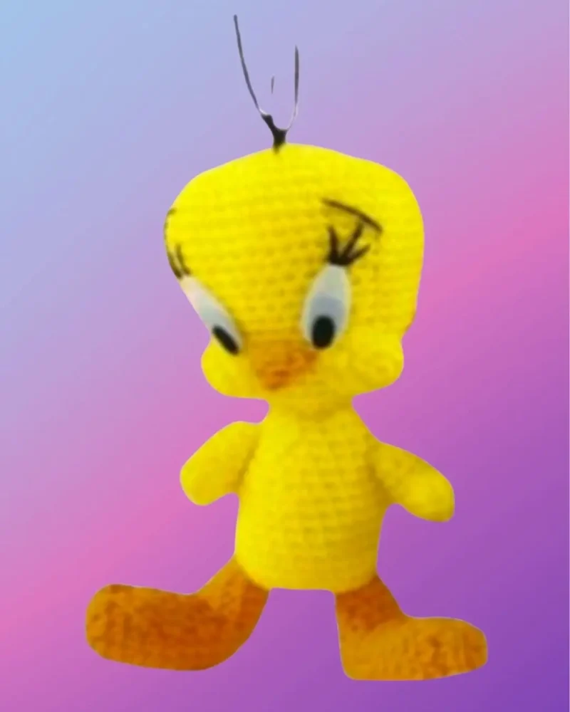 Handmade crochet Sunny Little Bird with oversized head and big feet.