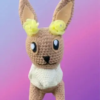 Handmade Woodland Friend with oversized ears and roses.